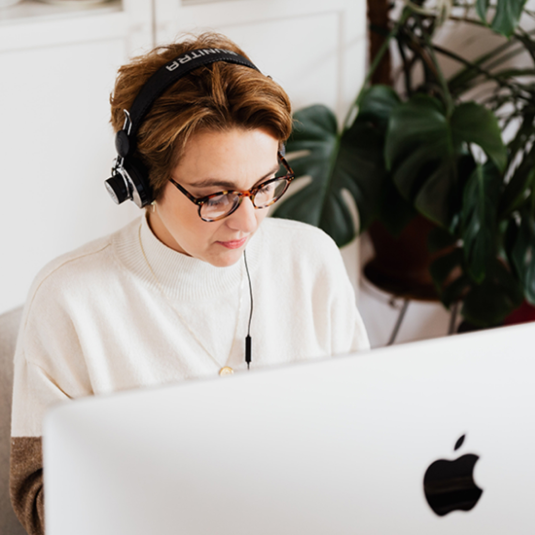 Woman listening to music while working