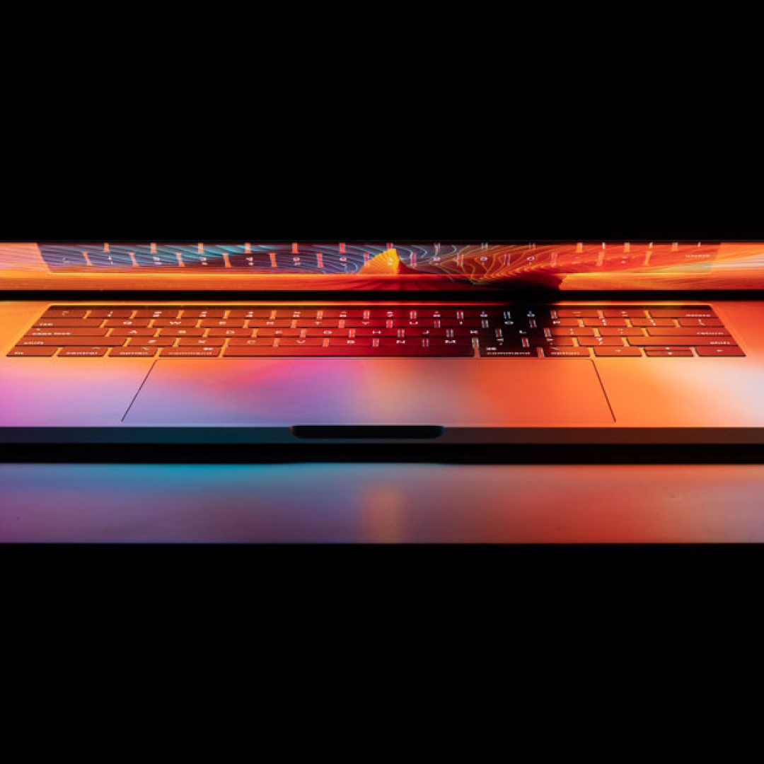 Open laptop with bright and colorful screen background