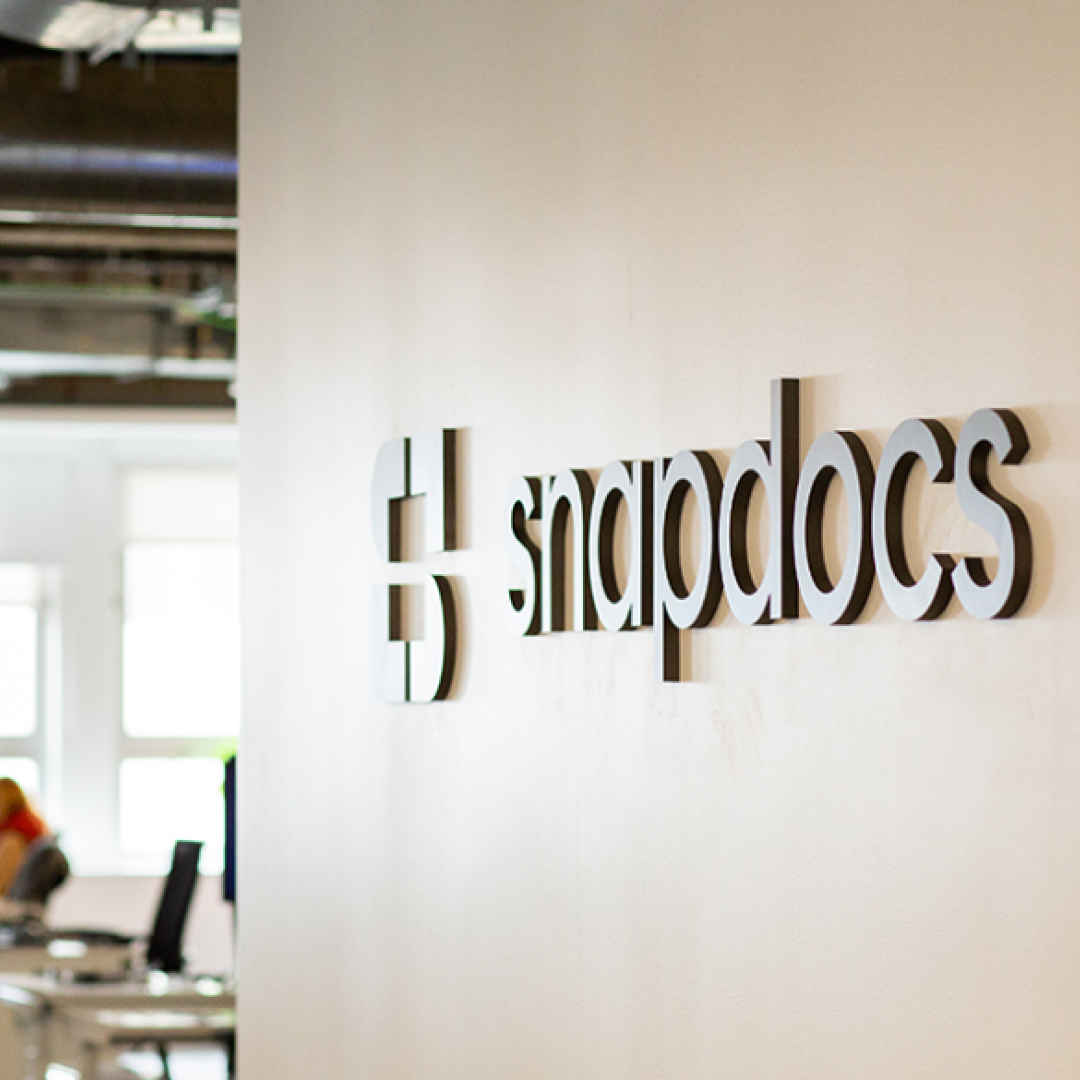 Snapdocs logo hanging on office wall
